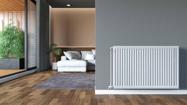 Central-heating-control-radiator-in-a-minimalist-apartment-with-wood-floors