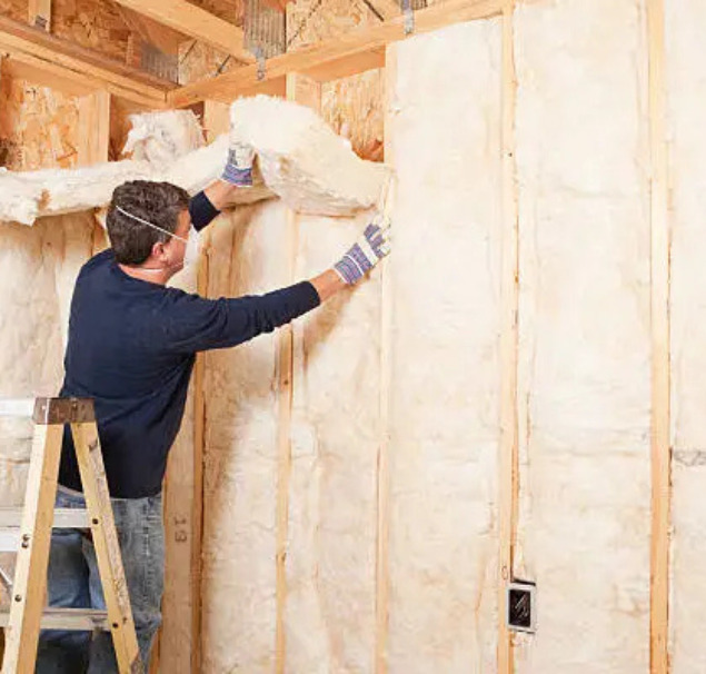 A-professional-installer-fitting-internal-insulation-during-a-free-wall-insulation-project-in-Oxford-UK